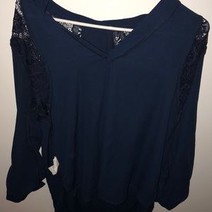 a blue long-sleeved blouse